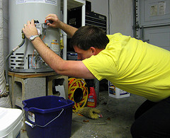 Fixing the water heater.